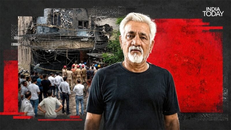 Delhi hotel owner tells cops he saw building on fire and walked past out of fear