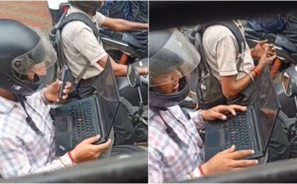 Traffic jam turns into office desk for man on bike. Work-life balance debate follows