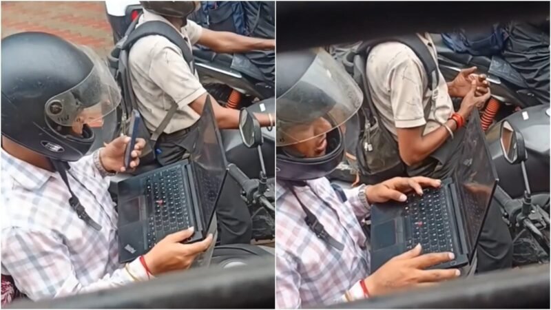 Traffic jam turns into office desk for man on bike. Work-life balance debate follows