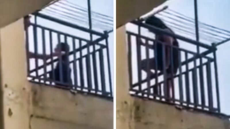 Video: Woman threatens to jump off balcony after fight with partner over reality show